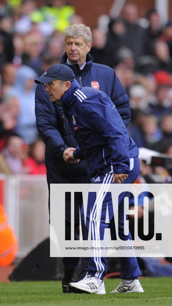 Arsene Wenger manager of Arsenal shakes hands with Tony Pullis manager of Stoke City. Barclays Premier League match between Stoke City v FC Arsenal London at The Britannia Stadium, Stoke on the 28th April 2012.. .