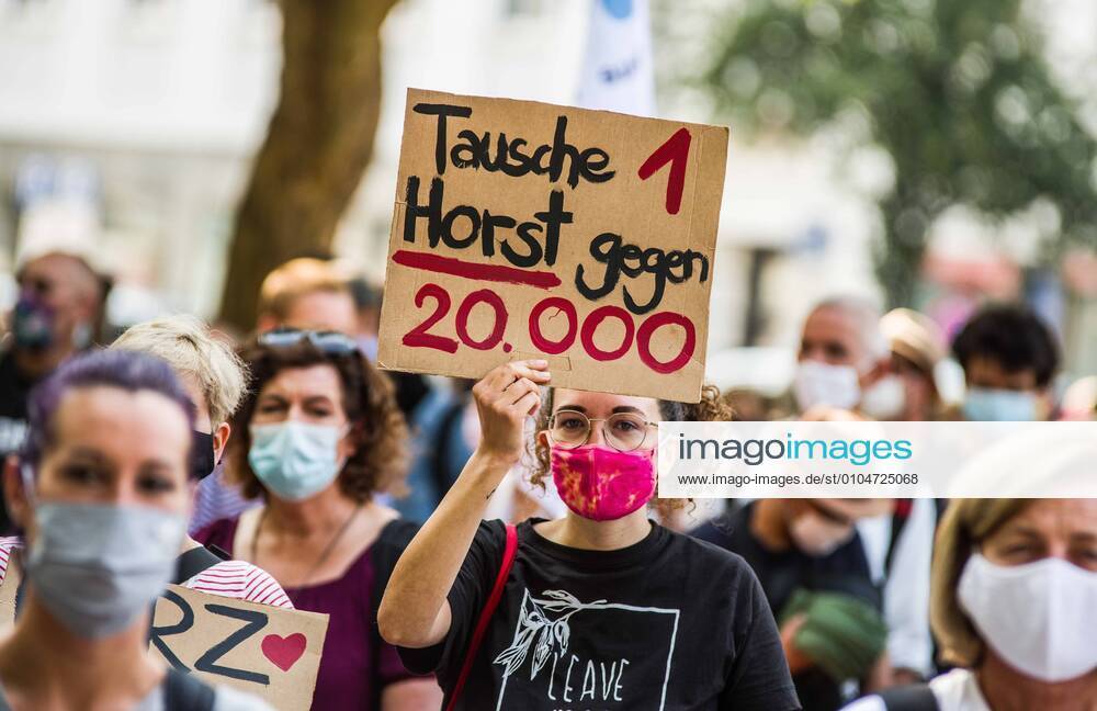 Criticisms of German Interior Minister Horst Seehofer offering to swap him for 20,000 refugees. Organized by the Seebruecke organization, over 1,000 residents of Munich, Germany joined other cities and demonstrated at Goetheplatz and marched to the Staatskanzlei for an immediate uptake of migrants and refugees from the Moria camp for migrants and refugees in Lesbos, Greece. The camp was originally designed for 3,000 residents and eventually swelled to 13,000 at the time a fired destroyed 99% of it. Germans are demanding a long-term solution to the politics of Europe that led to the creation of the camp and immediate evacuations saying Ã¢â‚¬oewir haben platzÃ¢â‚¬Â (Ã¢â‚¬oewe have spaceÃ¢â‚¬Â) - ZUMAb160 20200920_zbp_b160_004