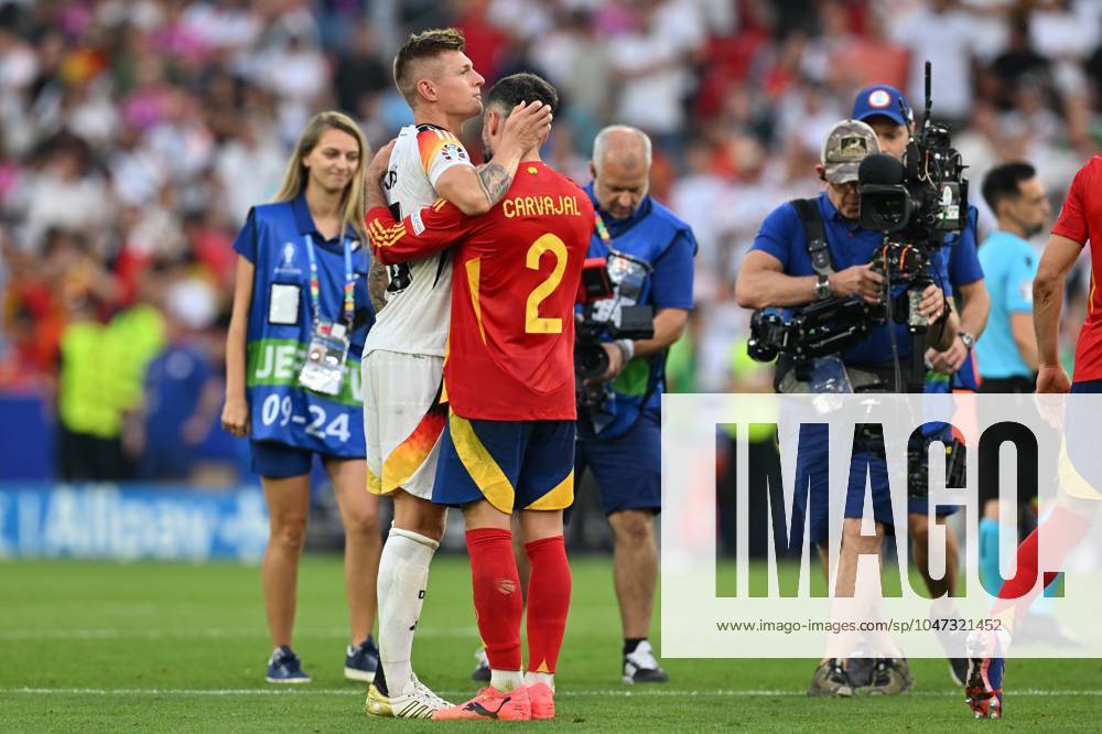 EURO2024 SPAIN VS GERMANY Toni Kroos (8) of Germany looking dejected and disappointed but being kissed and hugged by Dani Carvajal (2) of Spain after losing a soccer game between the national teams of Spain and Germany in the Quarter Final stage of the UEFA EURO, EM, Europameisterschaft,Fussball 2024 tournament , on Thursday 5 July 2024 in Stuttgart , Germany . PHOTO SPORTPIX David Catry STUTTGART GERMANY