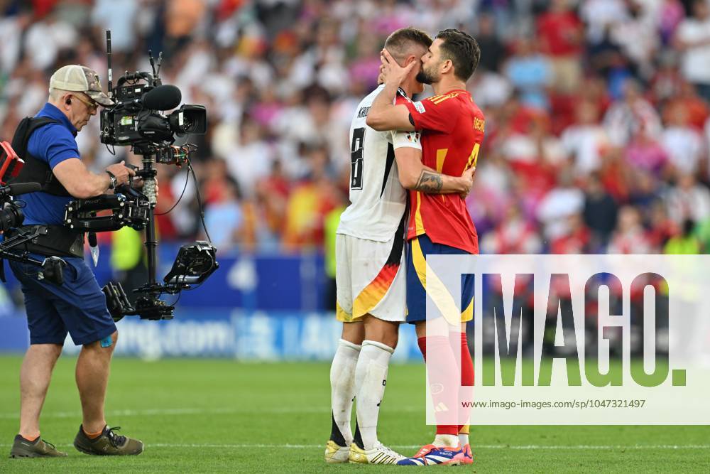 EURO2024 SPAIN VS GERMANY Toni Kroos (8) of Germany looking dejected and disappointed but being kissed and hugged by Nacho (Jose Ignacio Fernandez Iglesias) (4) of Spain after losing a soccer game between the national teams of Spain and Germany in the Quarter Final stage of the UEFA EURO, EM, Europameisterschaft,Fussball 2024 tournament , on Thursday 5 July 2024 in Stuttgart , Germany . PHOTO SPORTPIX David Catry STUTTGART GERMANY
