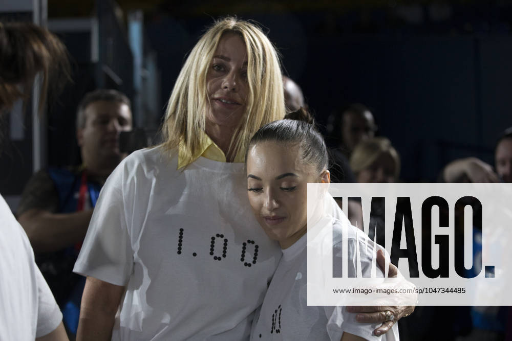 Artistic Gymnastics World Championships OCT 1 October 1, 2017: Gymnast Larisa Iordache (ROU) at podium training with legendary Romanian gymnast Nadia Comaneci, during the 47th FIG Artistic Gymnastics World Championships in Montreal, Canada. Both are seen wearing t-shirts that commemorate Comaneci scoring the first perfect 10.0 in Olympic history, at the 1976 Montreal games. Iordache suffered an achilles tear just before the start of competition and had to withdraw. Melissa J. Perenson CSM Montreal California Canada