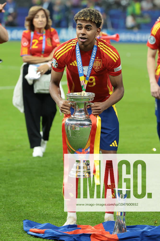 Berlin, Germany, 14th July 2024. Lamine Yamal of Spain poses with the Henri Delaunay Cup and his Young Player of the Tournament Award following the 2-1 victory in the UEFA European Championships final match at Olympiastadion, Berlin. Picture: Jonathan Moscrop Sportimage . SPI-3226-0372