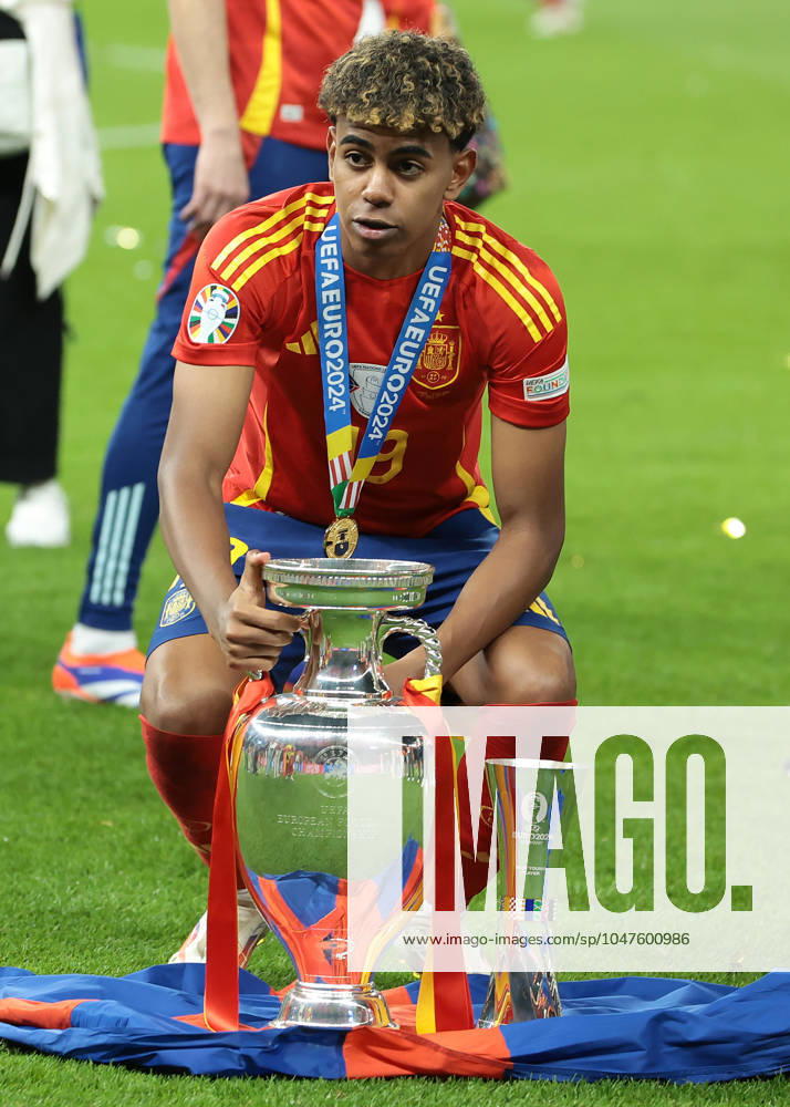Berlin, Germany, 14th July 2024. Lamine Yamal of Spain poses with the Henri Delaunay Cup and his Young Player of the Tournament Award following the 2-1 victory in the UEFA European Championships final match at Olympiastadion, Berlin. Picture: Jonathan Moscrop Sportimage . SPI-3226-0374