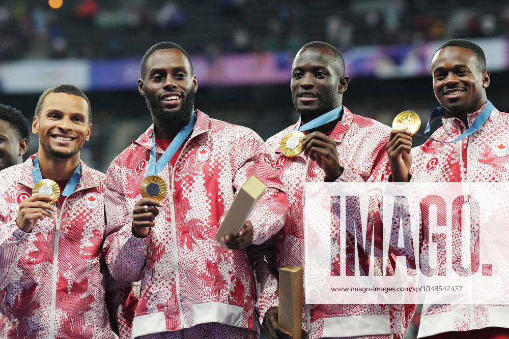 Canada s men s 4 x 100m relay team Andre De Grasse, left to right, Brendon Rodney, Jerome Blake and Aaron Brown celebrate with their gold medals on the podium during the Paris Summer Olympics in Saint-Denis, France, Friday, Aug. 9, 2024. Andre De Grasse, Brendon Rodney, Aaron Brown, Jerome Blake - ZUMAc35_ 20240809_zaf_c35_129