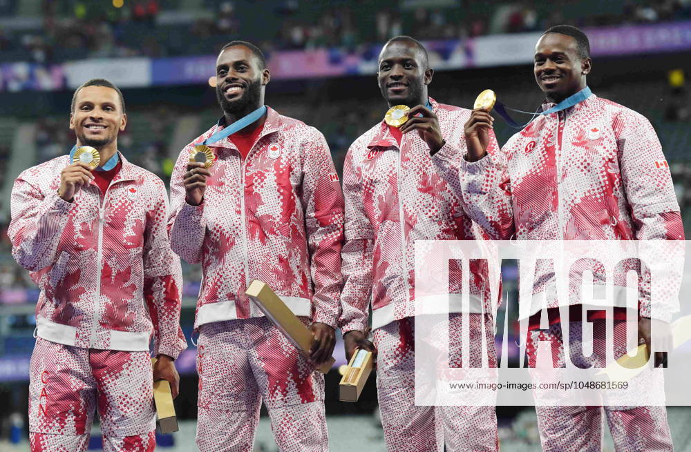 Canada s men s 4 x 100m relay team Andre De Grasse, left to right, Brendon Rodney, Jerome Blake and Aaron Brown celebrate with their gold medals on the podium during the Paris Summer Olympics in Saint-Denis, France, Friday, Aug. 9, 2024. Andre De Grasse, Brendon Rodney, Aaron Brown, Jerome Blake - ZUMAc35_ 20240809_zaf_c35_116