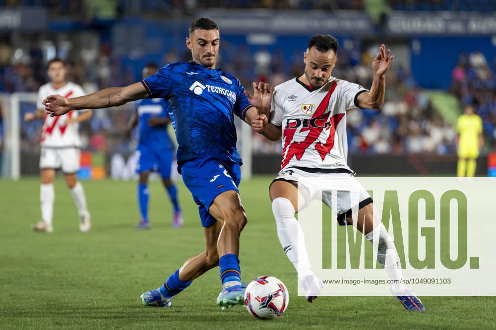 Getafe CF vs Rayo Vallecano - La Liga EA Sports 2024 25 Juan Iglesias (L) of Getafe CF in action against Alvaro Garcia (R) of Rayo Vallecano during the La Liga EA Sports 2024 25 football match between Getafe CF vs Rayo Vallecano at Estadio Coliseum on August 24, 2024 in Getafe, Spain. Getafe Estadio Coliseum Madrid Spain