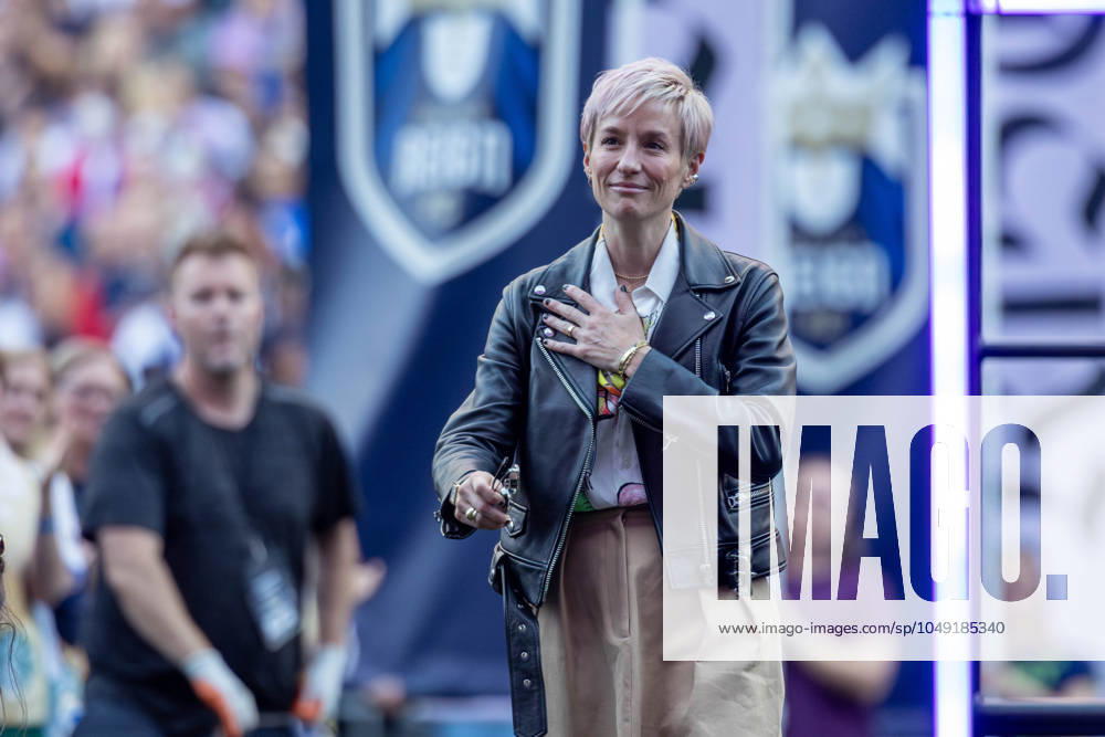Reign player MEGAN RAPINO 15 steps onto the stage is she is honored for her work on and off the soccer field in, before the game Reign vs Carolina Courage, with a game ending score of 1-0 on 8-25-24. Seattle USA - ZUMAl181 20240825_zsp_l181_002