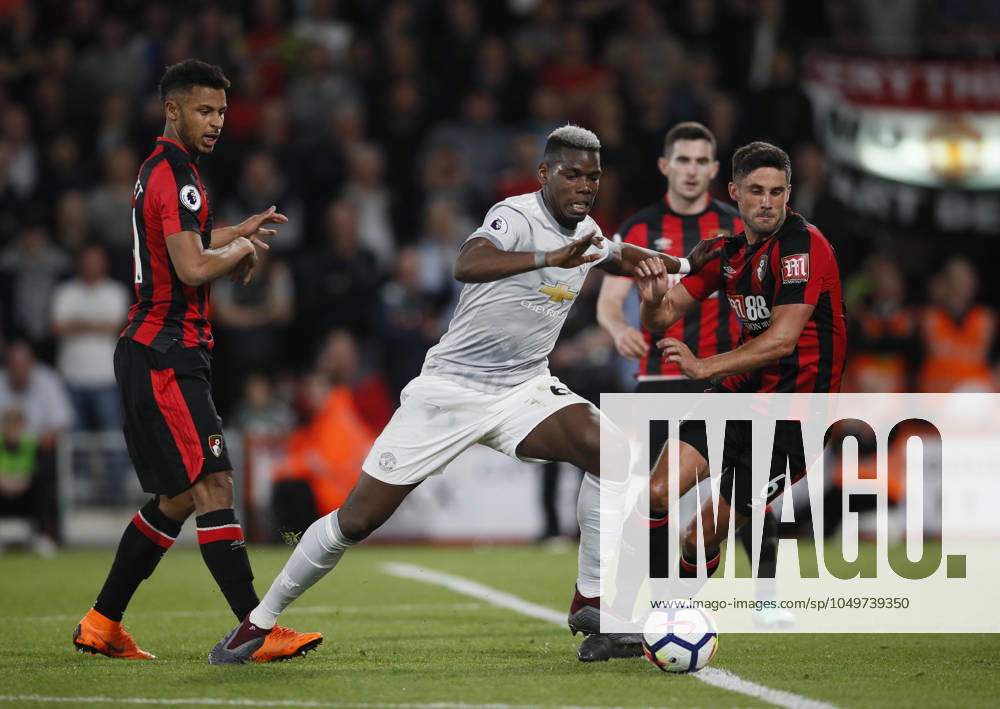 AFC Bournemouth v Manchester United, ManU - Premier League - Vitality Stadium April 18, 2018 - Bournemouth, United Kingdom - Paul Pogba of Manchester United goes down under a tackle by Andrew Surman of Bournemouth during the premier league match at the Vitality Stadium, Bournemouth. Picture date 18th April 2018. Picture credit should read: David Klein Sportimage Bournemouth United Kingdom