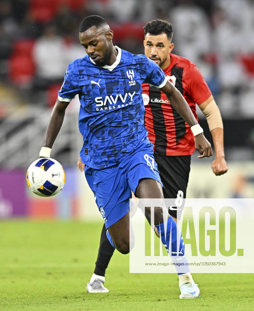 AFC CHAMPIONS LEAGUE ELITE, AL RAYYAN FC V AL-HILAL SFC Mahmoud Hassan (R) of Al Rayyan SC and Hassan Al Tambakti of Al-Hilal SFC in action during the AFC Champions League elite west football match between Qatar s Al Rayyan SC and Saudi Arabia s Al-Hilal SFC at Ahmad Bin Ali Stadium in Al Rayyan, Qatar on September 17, 2024. DOHA Qatar