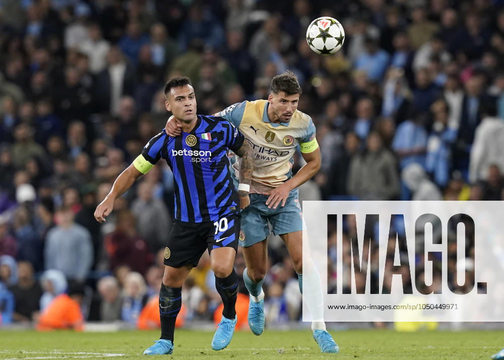 Manchester, England, 18th September 2024. Ruben Dias of Manchester City tussles with Lautaro Martinez of Inter Milan during the UEFA Champions League match at the Etihad Stadium, Manchester. Picture credit should read: Andrew Yates Sportimage . SPI-3321-0058