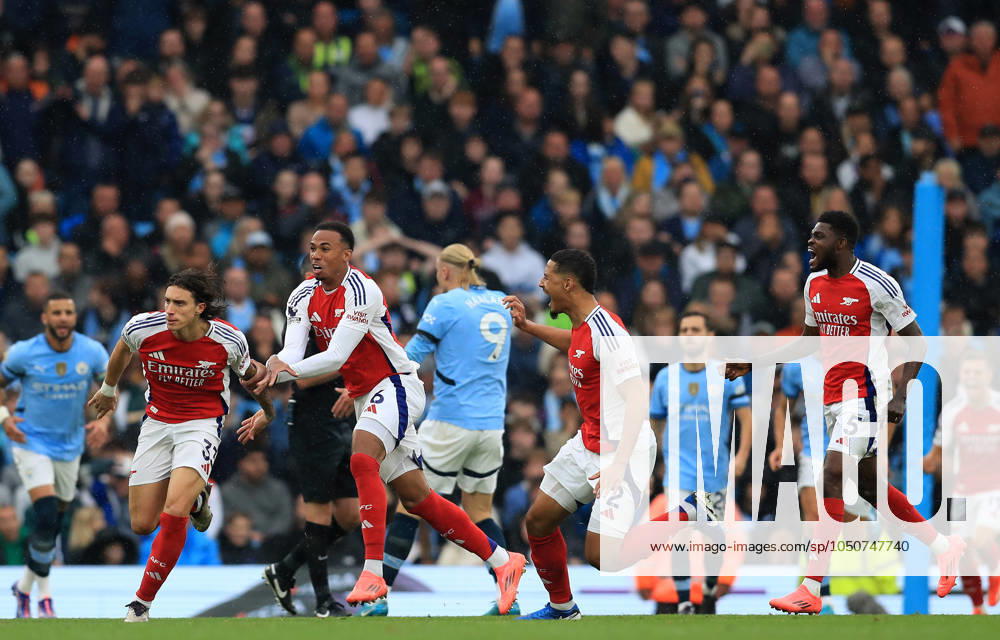 22nd September 2024; Etihad Stadium, Manchester, England; Premier League Football, Manchester City versus Arsenal; Riccardo Calafiori of Arsenal celebrates after scoring for 1-1 after 22 minutes ActionPlus12696246 DavidxBlunsden Content restricted for UK based newspaper