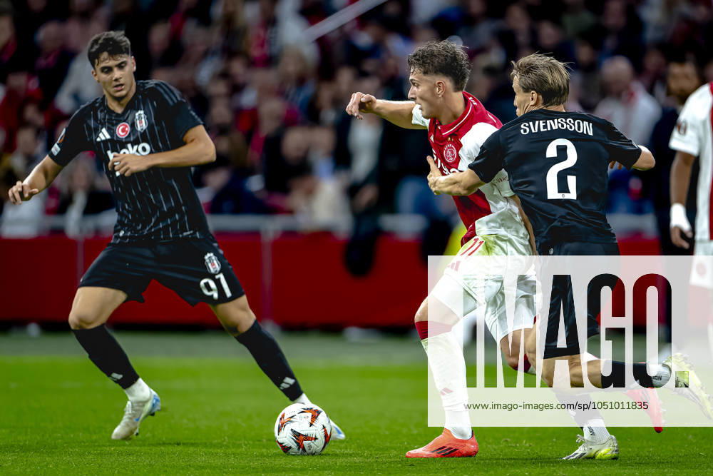 AFC Ajax Amsterdam forwarder Mika Godts, Besiktas JK defender Jonas Svensson, during the match Ajax - Besiktas at the Johan Cruijff ArenA for the UEFA Europa League - League phase - Matchday 1 season 2024-2025 in AMSTERDAM, Netherlands on 26 september 2024, (photo by Marcel van Dorst EYE4images DeFodi Images) Defodi-746_190845