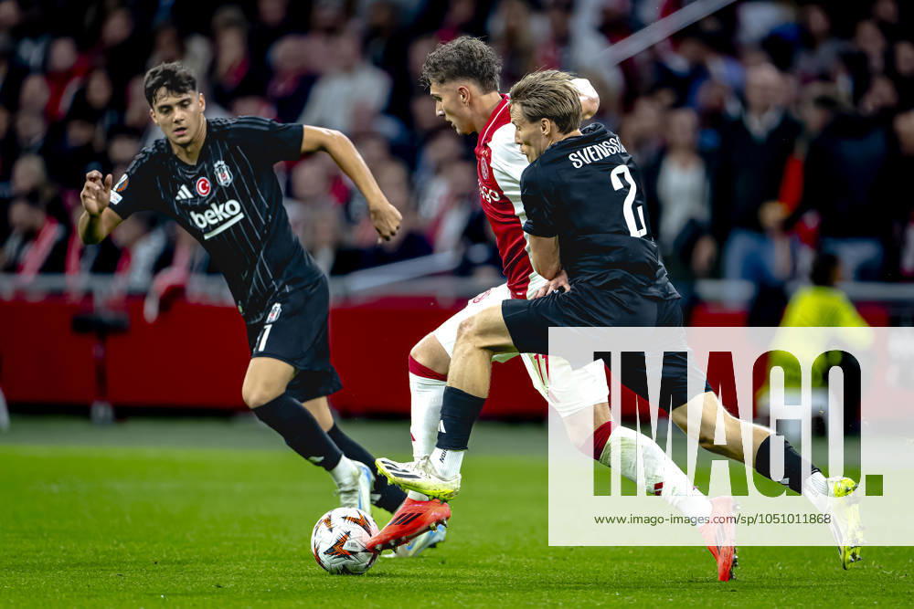 AFC Ajax Amsterdam forwarder Mika Godts, Besiktas JK defender Jonas Svensson, during the match Ajax - Besiktas at the Johan Cruijff ArenA for the UEFA Europa League - League phase - Matchday 1 season 2024-2025 in AMSTERDAM, Netherlands on 26 september 2024, (photo by Marcel van Dorst EYE4images DeFodi Images) Defodi-746_190846