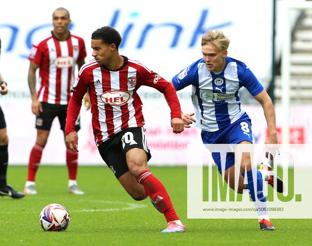 Wigan Athletic v Exeter City EFL Sky Bet League 1 28 09 2024. Exeter City midfielder Kamari Doyle (20) and Wigan Athletic midfielder Matt Smith (8) during the EFL Sky Bet League 1 match between Wigan Athletic and Exeter City at the Brick Community Stadium, Wigan, England on 28 September 2024. Wigan Brick Community Stadium Greater Manchester England Editorial use only DataCo restrictions apply See www.football-dataco.com ,