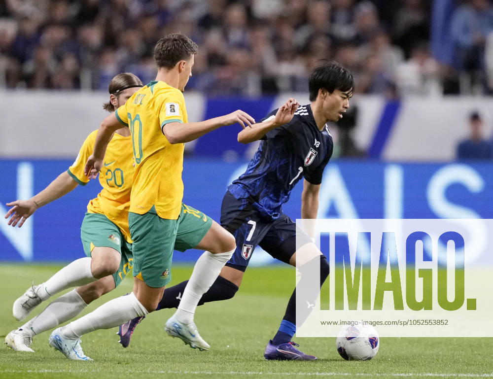 Football: World Cup qualifier Kaoru Mitoma (R) of Japan dribbles the ball in the first half of a 2026 football World Cup final-round Asian qualifier against Australia at Saitama Stadium in Saitama near Tokyo on Oct. 15, 2024. A14AA0003586090P