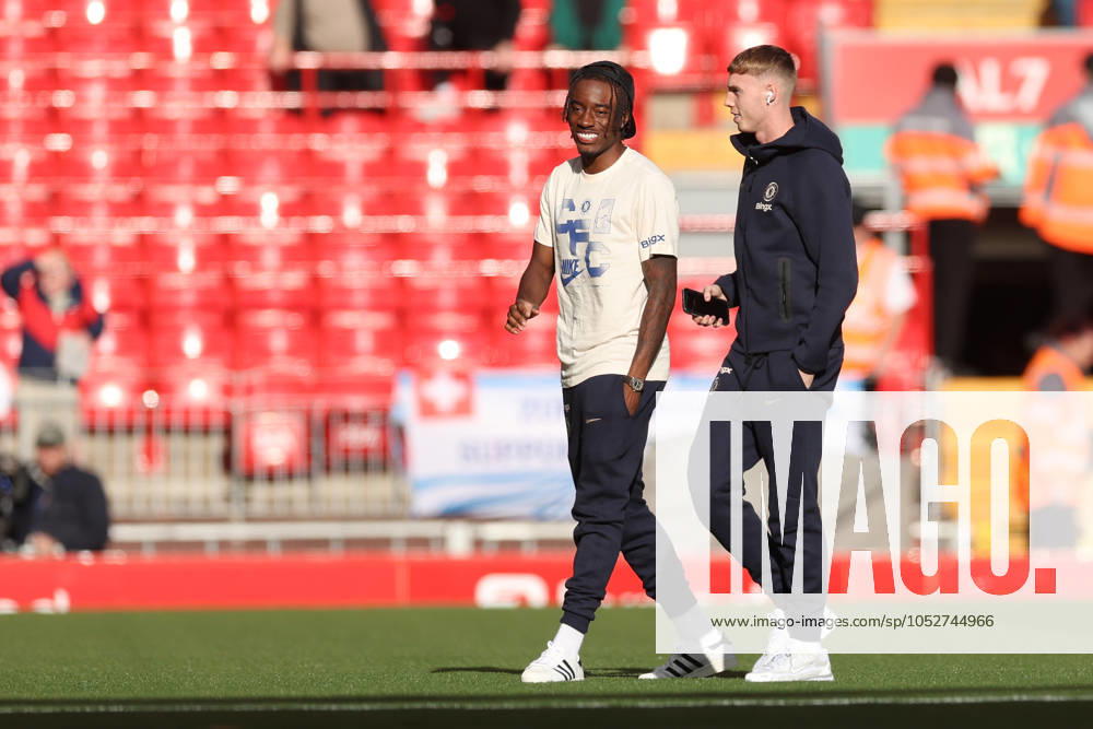 Football - 2024 2025 Premier League - Liverpool v Chelsea - Anfield - Sunday 20th October 2024 Cole Palmer of Chelsea walks the pitch before the start of the match with Noni Madueke