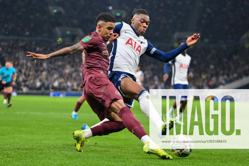Tottenham Hotspur v Manchester City EFL Cup 30 10 2024. Manchester City forward Savinho (26) crosses the ball under pressure from Tottenham Hotspur defender Destiny Udogie (13) during the EFL Cup match between Tottenham Hotspur and Manchester City at Tottenham Hotspur Stadium, London, United Kingdom on 30 October 2024. London Tottenham Hotspur Stadium London United Kingdom Editorial use only DataCo restrictions apply See www.football-dataco.com ,