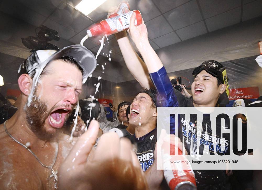 Baseball: MLB, Baseball Herren, USA World Series Los Angeles Dodgers players (from L) Clayton Kershaw, Yoshinobu Yamamoto and Shohei Ohtani celebrate with champagne in the small hours of Oct. 31, 2024, after clinching the MLB World Series with a 7-6 win over the New York Yankees in Game 5 at Yankee Stadium in New York. A14AA0003663854P