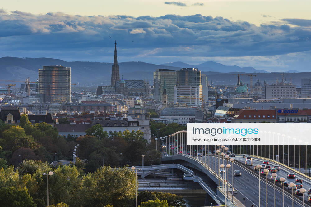 Vienna city center, river Donau (Danube), bridge Reichsbrücke, cathedral Stephansdom, mountain Alps Wien, Vienna Wien Austria 00. overview