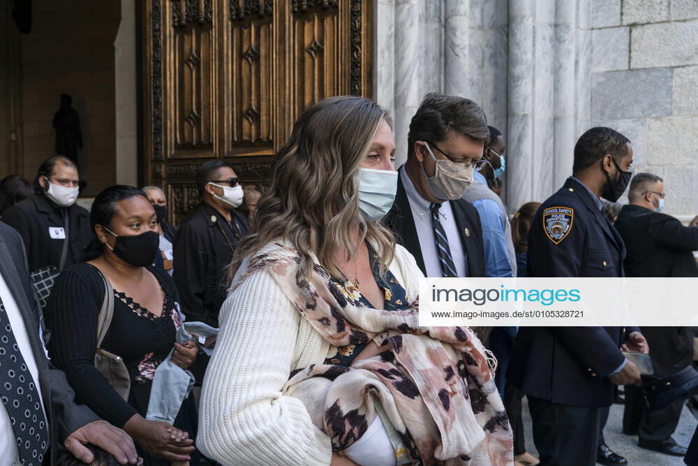 NYPD holds mass for members died of COVID-19 Family members and police officers leave cathedral after NYPD holds mass honoring members died of COVID-19 at St. Patrick s Cathedral. 46 members of NYPD Died during pandemic so far and many of them did not receive proper funeral due to pandemic restrictions. Almost 20% of NYPD members were sick with coronavirus during pick of pandemic in the city. Cardinal Timothy Dolan lead the mass. Mayor Bill de Blasio and Police commissioner Dermot Shea speak. New York New York United States