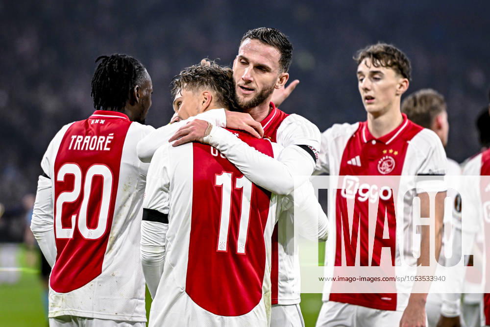 AFC Ajax Amsterdam forwarder Mika Godts and AFC Ajax Amsterdam midfielder Branco van den Boomen celebrating the goal 3-0, during the match Ajax - Maccabi Tel Aviv at the Johan Cruijff ArenA for the UEFA Europa League - League phase - Matchday 4 season 2024-2025 in AMSTERDAM, Netherlands on 7 november 2024, (photo by Stefan Koops EYE4images DeFodi Images) not used in POL SRB CRO FRA GBR NED ITA USA Defodi-746_198840