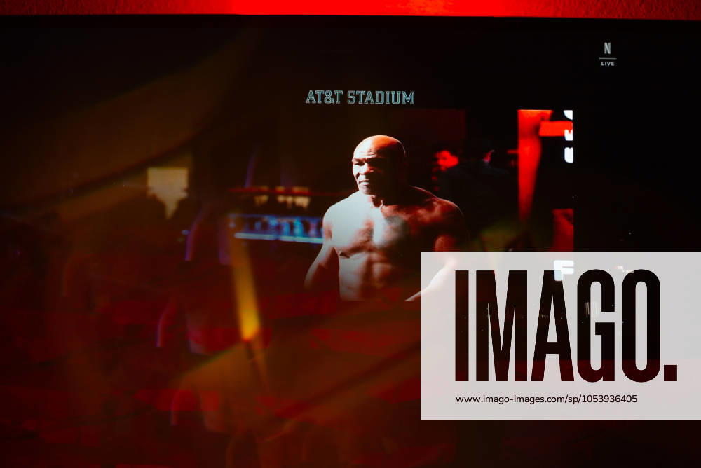 Reflections of the Paul, Tyson fight as viewed online presented by Netflix. Jake Paul wins the fight against Mike Tyson by unanimous decision after a full eight-round heavyweight match in AT&T Stadium in front of 70,000 fans on Friday. Hosted onine by Netflix with an estimated tens of millions of viewers. Manhattan USA - ZUMAt152 20241116_znp_t152_001