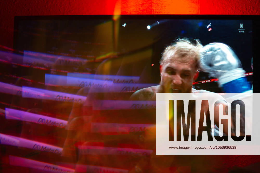 Reflections of the Paul, Tyson fight as viewed online presented by Netflix. Jake Paul wins the fight against Mike Tyson by unanimous decision after a full eight-round heavyweight match in AT&T Stadium in front of 70,000 fans on Friday. Hosted onine by Netflix with an estimated tens of millions of viewers. Manhattan USA - ZUMAt152 20241116_znp_t152_007