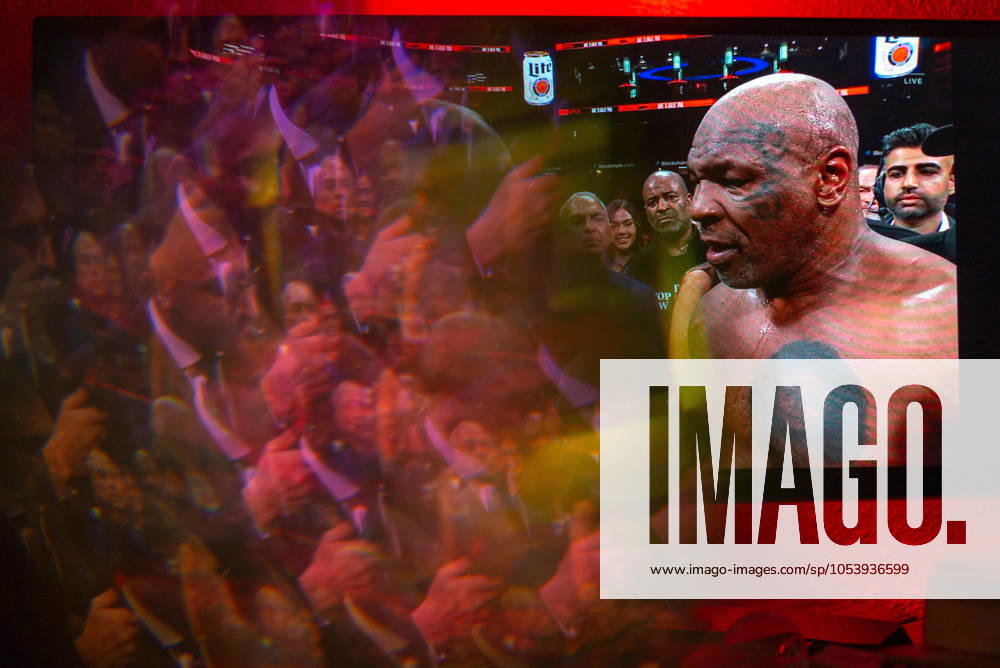 Reflections of the Paul, Tyson fight as viewed online presented by Netflix. Jake Paul wins the fight against Mike Tyson by unanimous decision after a full eight-round heavyweight match in AT&T Stadium in front of 70,000 fans on Friday. Hosted onine by Netflix with an estimated tens of millions of viewers. Manhattan USA - ZUMAt152 20241116_znp_t152_025