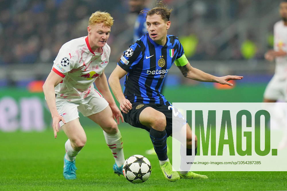 Inter Milan s Nicolo Barella fights for the ball with Leipzig s Antonio Nusa during the Uefa Champions League soccer match between Inter and Leipzig at the San Siro Stadium in Milan, north Italy - Tuesday , November 26 , 2024. - Soccer .
