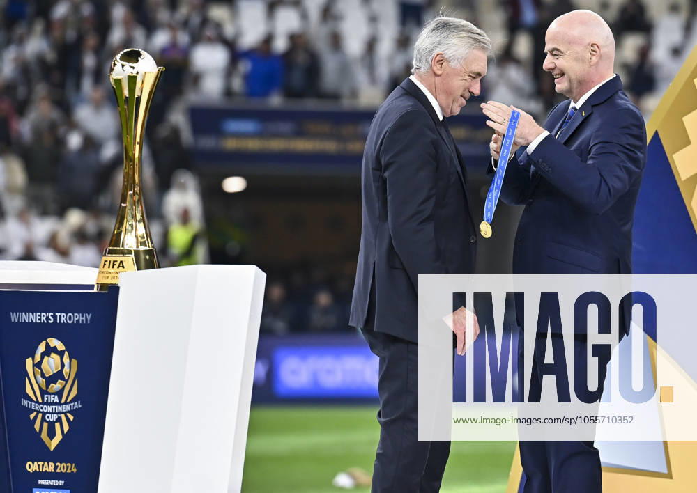 (241219) -- LUSAIL, Dec. 19, 2024 -- FIFA President Gianni Infantino (R) awards Carlo Ancelotti, head coach of Real Madrid, with the gold medal during the podium ceremony after the FIFA Intercontinental Cup Qatar 2024 Final match between Spain s Real Madrid and Mexico s CF Pachuca at Lusail Stadium in Lusail, Qatar, on Dec. 18, 2024. (Photo by Xinhua) (SP)QATAR-LUSAIL-FIFA INTERCONTINENTAL CUP-FINAL-REAL MADRID VS PACHUACA Nikku