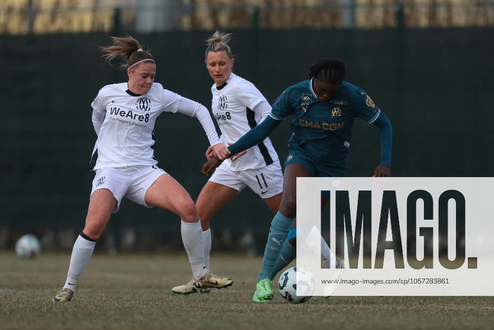 Cislago, Italy, 4th January 2025. Mina Bergersen of FC Como Women tussles with Mama Diop of Olympique De Marseille as Dominika Conc of FC Como Women looks on during the Friendly match at Village, Cislago. Picture credit should read: Jonathan Moscrop Sportimage . SPI_016_JM_COMO_MARSEILLE_FEMM SPI-3569-0016