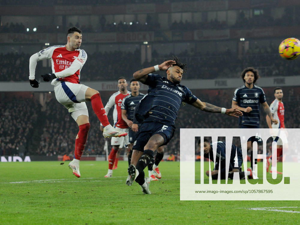 Football - 2024 2025 Premier League - Arsenal vs Aston Villa - Emirates Stadium - Saturday 18th January 2025 Gabriel Martinelli of Arsenal shoots past Tyrone Mings COLORSPORT Andrew Cowie