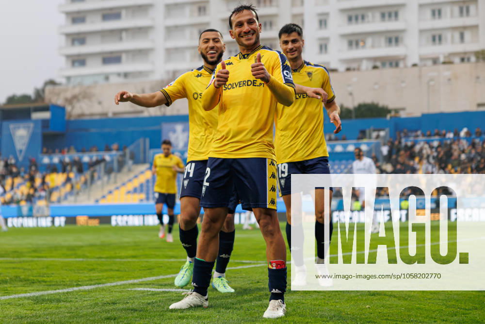 Players of Estoril seen celebrating after goal from Joao Carvalho during Liga Portugal game between teams of GD Estoril Praia and Vitoria SC at Estadio Antonio Coimbra da Mota (Maciej Rogowski) Estoril Estadio Antonio Coimbra da Mota Portugal