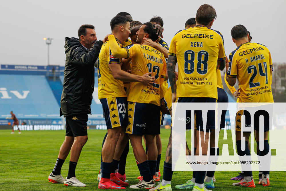 Players of Estoril seen celebrating after goal from Joao Carvalho during Liga Portugal game between teams of GD Estoril Praia and Vitoria SC at Estadio Antonio Coimbra da Mota (Maciej Rogowski) Estoril Estadio Antonio Coimbra da Mota Portugal