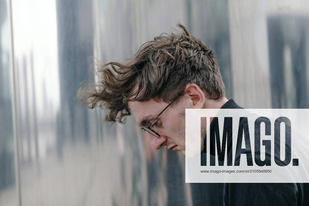 Close-up of thoughtful man wearing eyeglasses looking down model released Symbolfoto OGF00572