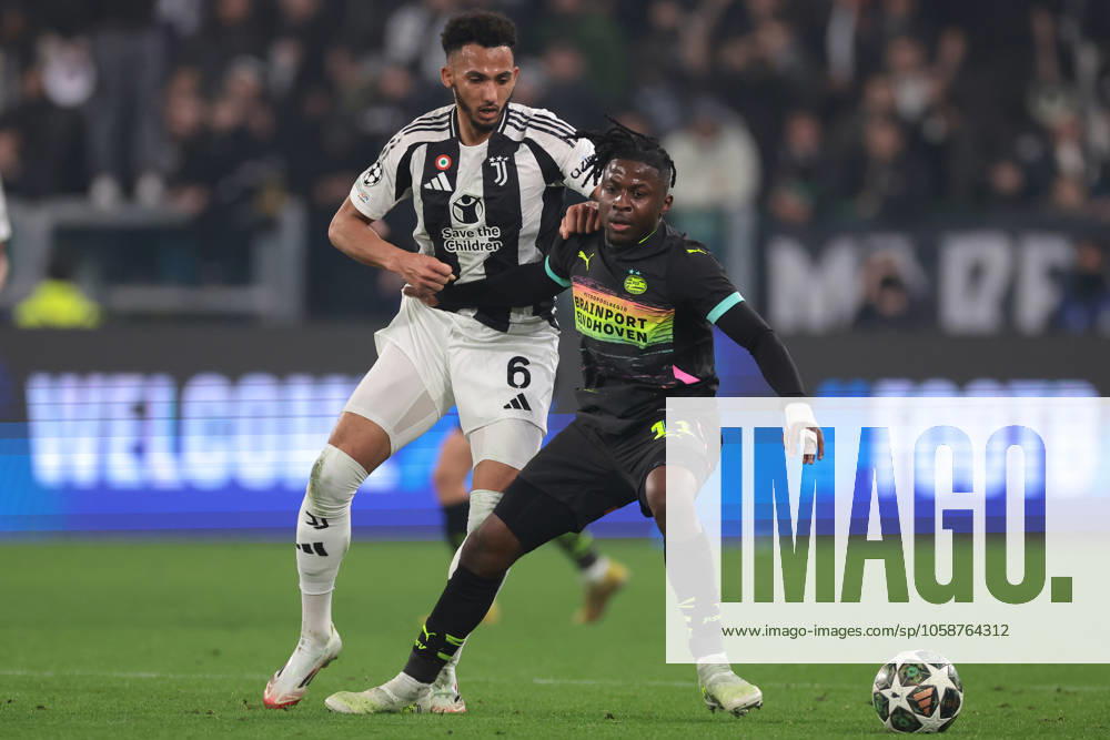 Turin, Italy, 11th February 2025. Lloyd Kelly of Juventus tussles with Johan Bakayoko of PSV Eindhoven during the UEFA Champions League match at Allianz Stadium, Turin. Picture credit should read: Jonathan Moscrop Sportimage . SPI_086_JM_JUVE_PSV_UCL SPI-3661-0093