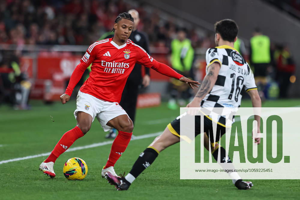 SL Benfica Vs Boavista FC in Lisbon, Portugal - 22 Feb 2025 (L-R) Leandro Santos of SL Benfica with Joel Silva of Boavista FC in action during the Liga Portugal Betclic match between SL Benfica and Boavista FC at Estadio da Luz. (Final score: SL Benfica 3 - 0 Boavista FC) Lisbon Portugal