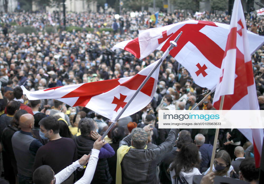 Supporters of Georgian opposition parties wave Georgian flags as they protest against the results of the 2020 Georgian parliamentary election outside the offices of the Georgian Parliament in Rustaveli Avenue. With votes from 97% of polling stations counted, the ruling Georgian Dream-Democratic Georgia Party has won 48% of the vote. David Mdzinarishvili TASS TS0ECD4F