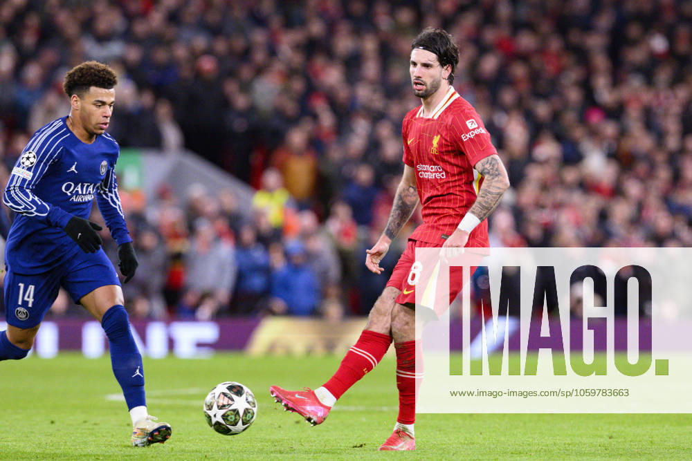 Liverpool FC v Paris Saint-Germain - UEFA Champions League 2024 25 Round of 16 Second Leg LIVERPOOL, ENGLAND - MARCH 11: Dominik Szoboszlai of Liverpool (R) passes the ball during the Extended Time of UEFA Champions League 2024 25 Round of 16 Second Leg match between Liverpool FC and Paris Saint-Germain at Anfield on March 11, 2025 in Liverpool, England. LiverpoolUnited Kingdom