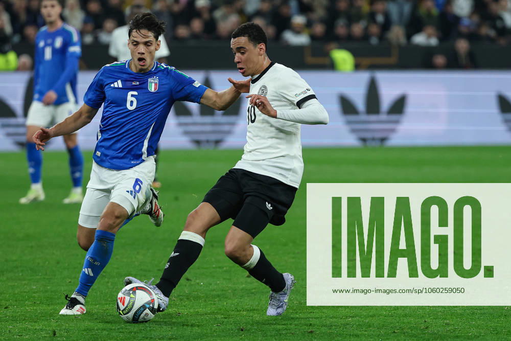UEFA Nations League - 24 25 - Deutschland - Italien am 23.03.2025 im Signal Iduna Park in Dortmund Jamal Musiala (Deutschland 10) gegen Samuele Ricci (Italien 6)