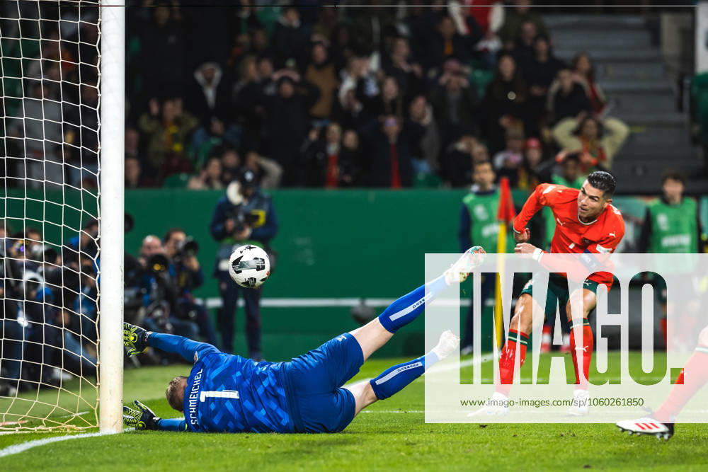 Cristiano Ronaldo of Portugal (R) and goalkeeper Kasper Schmeichel of Denmark (L) in action during the UEFA Nations League Quarterfinal Leg Two match between Portugal and Denmark at Estadio Jose Alvalade. Lisbon Portugal - ZUMAs197 20250323_aaa_s197_530