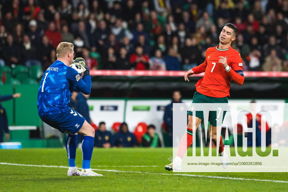 Cristiano Ronaldo of Portugal (R) and goalkeeper Kasper Schmeichel of Denmark (L) in action during the UEFA Nations League Quarterfinal Leg Two match between Portugal and Denmark at Estadio Jose Alvalade. Lisbon Portugal - ZUMAs197 20250323_aaa_s197_535