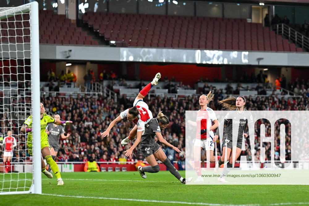 Kim Little of Arsenal Women challenges for the crossed ball and somersaults over Shelia Garcia of Real Madrid Women during the Womens Champions League match between Arsenal Women and Real Madrid Women at the Emirates Stadium, London, England on 26 March 2025.