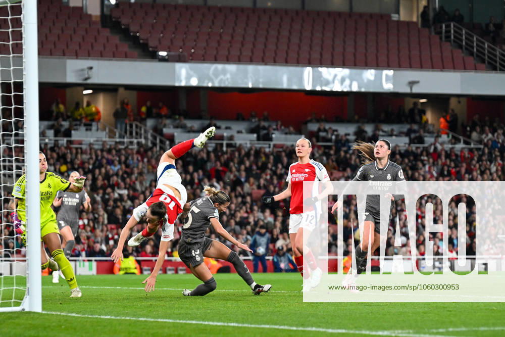 Kim Little of Arsenal Women challenges for the crossed ball and somersaults over Shelia Garcia of Real Madrid Women during the Womens Champions League match between Arsenal Women and Real Madrid Women at the Emirates Stadium, London, England on 26 March 2025.
