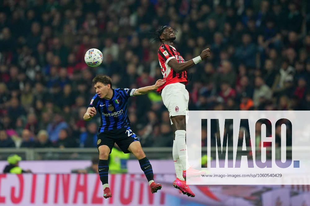Inter MilanÕs Nicolo Barella . fights for the ball with AC Milan s Tammy Abraham during the Italy Cup Frecciarossa soccer match between Milan and Inter at San Siro Stadium in Milan , North Italy - Wednesday April 02 , 2025 . - Soccer .