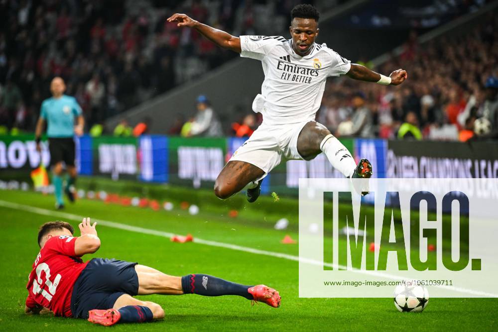 Villeneuve-D ascq, France, France: Thomas MEUNIER of Lille and Vinicius Junior (Jr) of Real Madrid during the UEFA Champions League, League Phase MD2 match between Lille OSC (LOSC) and Real Madrid at Pierre Mauroy Stadium on October 02, 2024 in Villeneuve-d Ascq near Lille, France. Villeneuve-D ascq France - ZUMAm308 20241002_zsp_m308_149