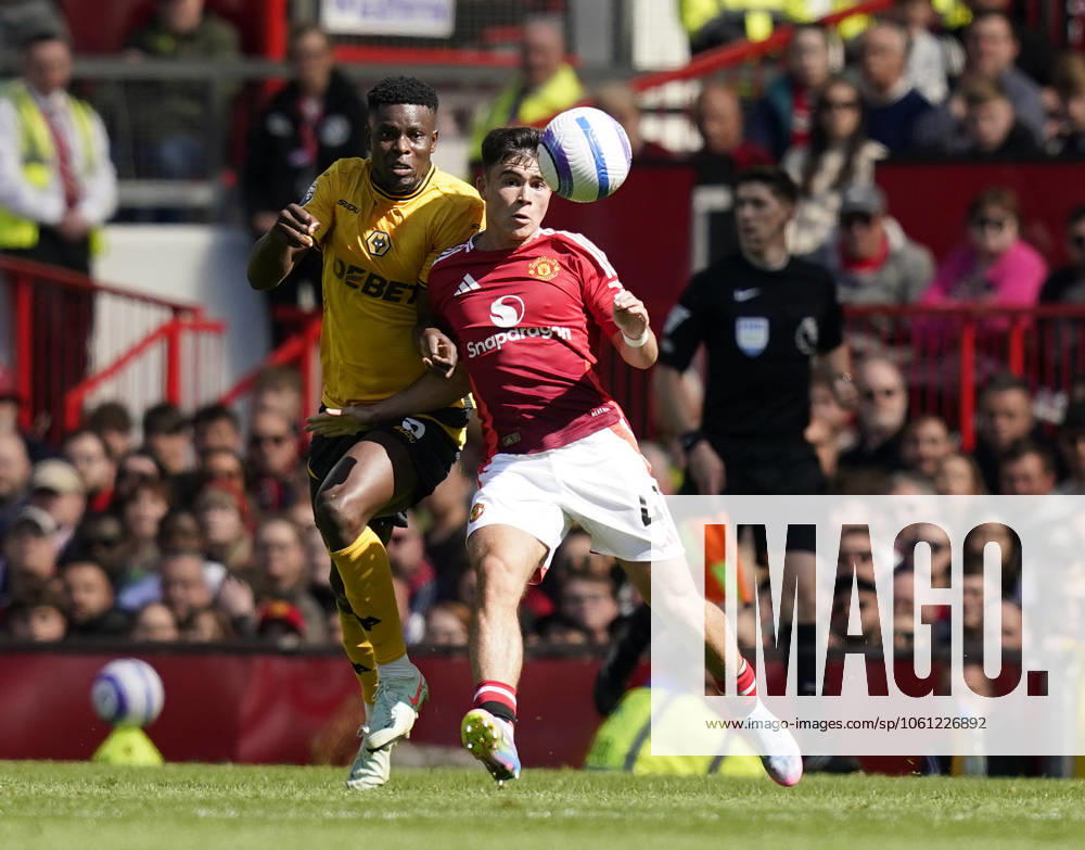 Manchester, England, 20th April 2025. Harry Amass of Manchester United, ManU (R) is challenged by Marshall Munetsi of Wolverhampton Wanderers during the Manchester United vs Wolverhampton Wanderers Premier League match at Old Trafford, Manchester. Picture credit should read: Andrew Yates Sportimage . SPI_045_AY_MAN_UTD_WOLVES SPI-3852-0033