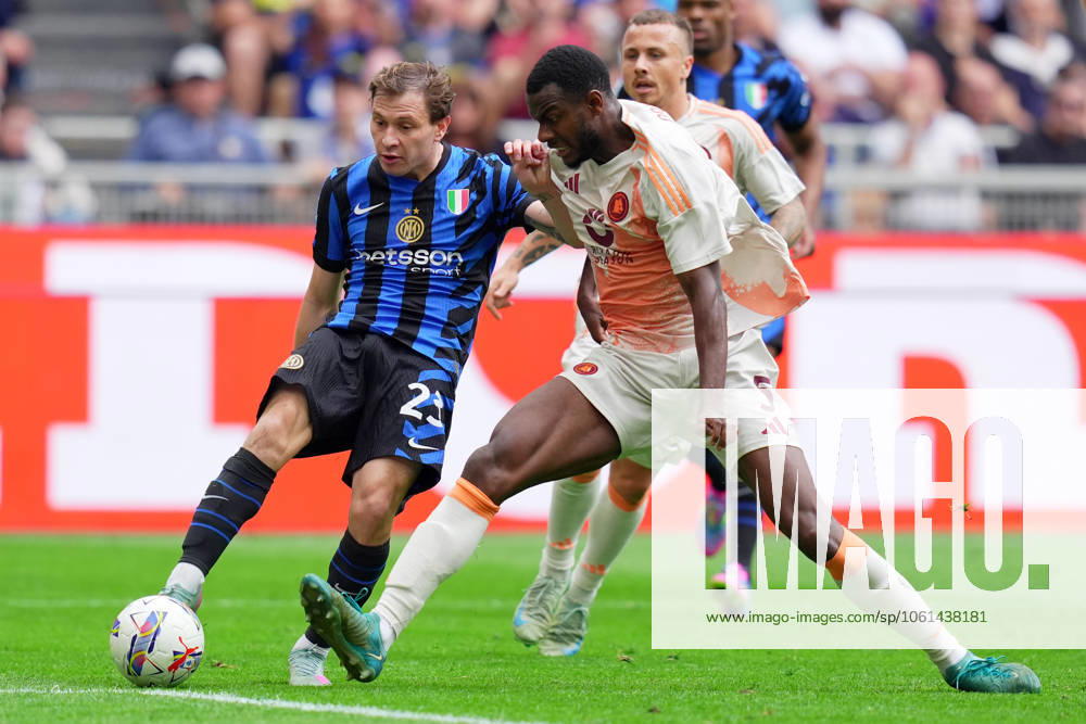Inter MilanÕs Nicolo Barella fights for the ball with RomaÕs Evan Ndicka during the Serie A soccer match between Inter and Roma at San Siro Stadium in Milan , North Italy - , Sunday, April 27 , 2025 . - Soccer