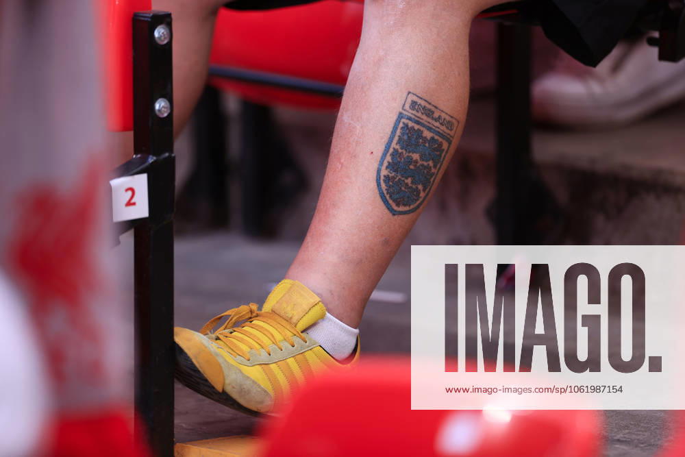 Liverpool FC v Arsenal FC - Premier League LIVERPOOL, ENGLAND - MAY 11: A three lions England badge tattoo is seen on a fan s leg during the Premier League match between Liverpool FC and Arsenal FC at Anfield on May 11, 2025 in Liverpool, England. (Photo by Simon Stacpoole Offside Offside via Getty Images) Liverpool England United Kingdom