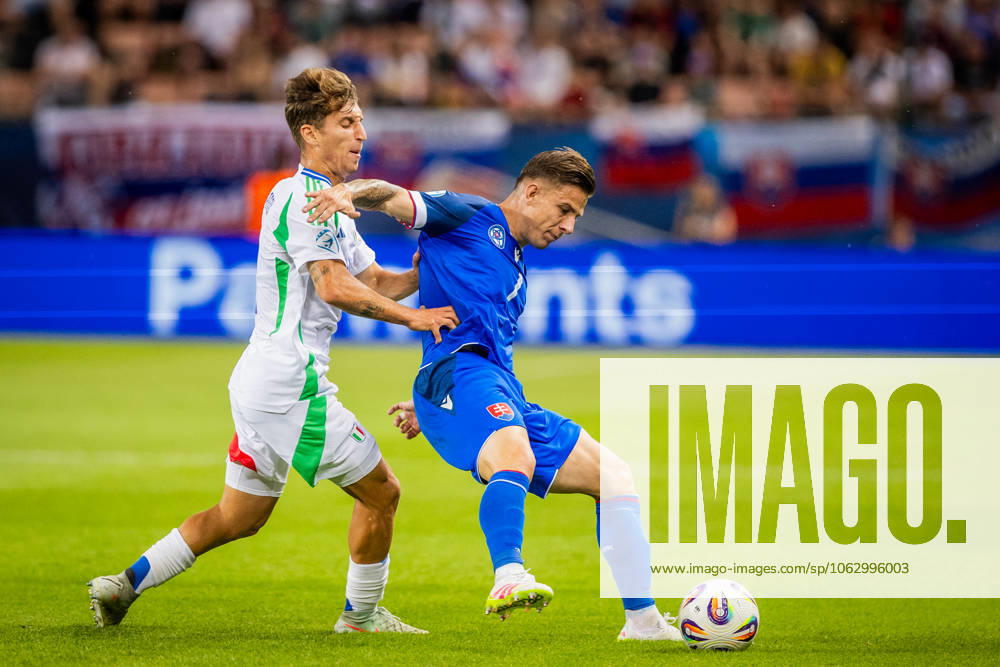 SLOVAKIA U21, U 21 - ITALY U21 Tomas Suslov of Slovakia and Tommaso Baldanzi of Italy during the UEFA European Under-21 Championship 2025 Group A football match between Slovakia U21 and Italy U21. Stadium City Arena, Trnava, Slovakia, June 14, 2025. Photo by Branislav Racko